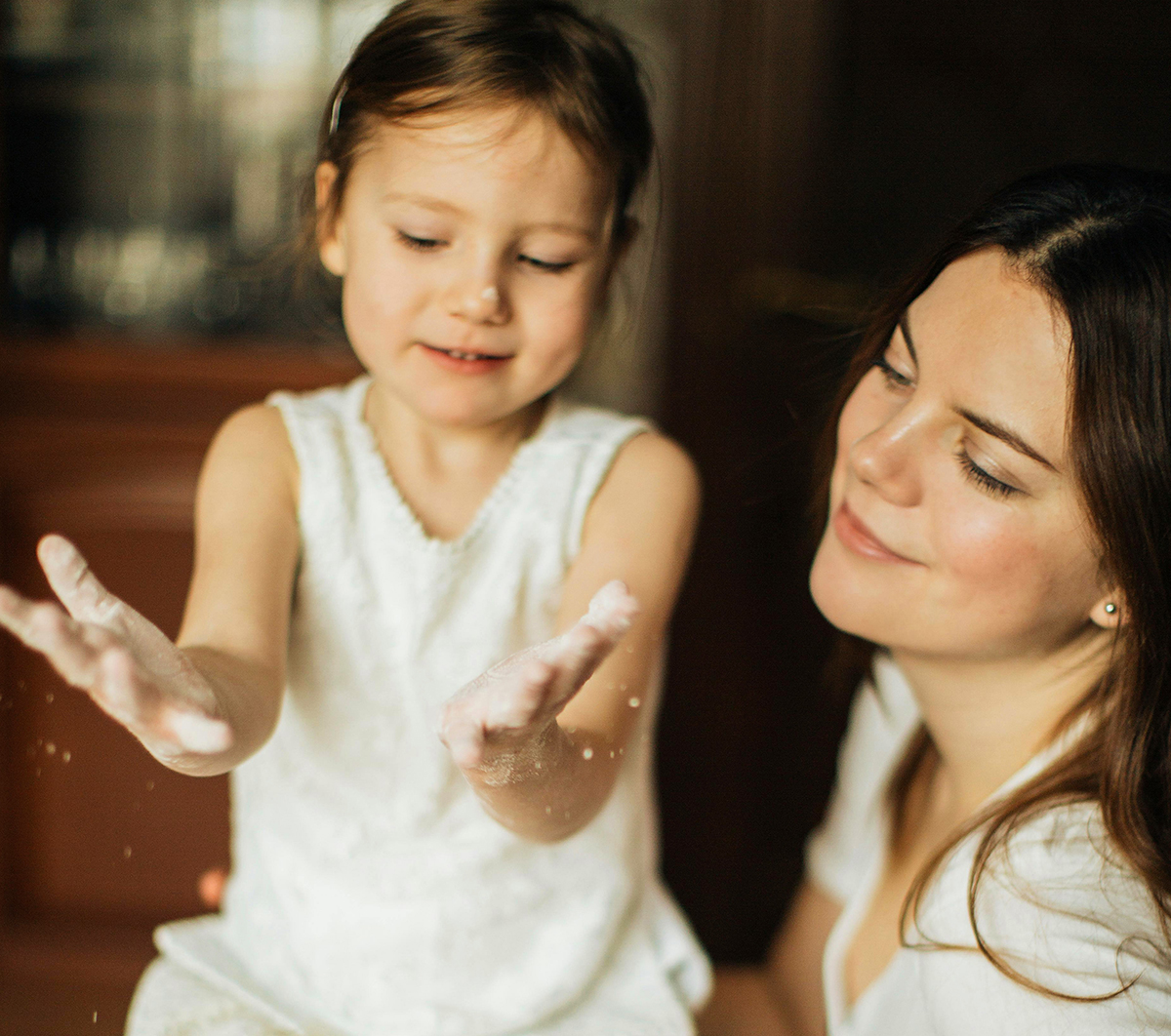 Mother and daughter enjoying a special bonding moment at home.